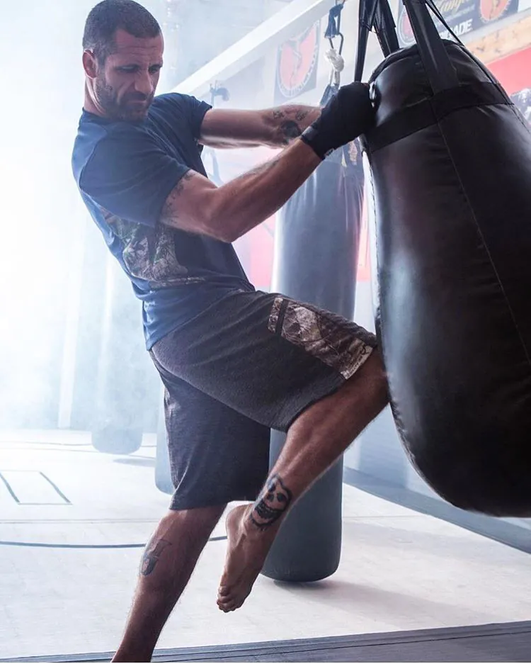 Muay Thai knee strike heavy bag training at HB Fight Club Huntington Beach CA