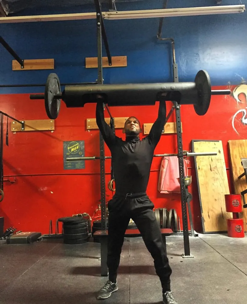 Strength conditioning log lift at HB Fight Club in Huntington Beach CA